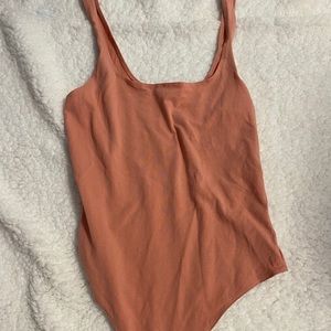peach colored garage bodysuit